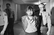 In this Dec. 21, 1970, file photo, Charles Manson reacts to photographers as he goes to lunch after an outbreak in court that resulted in his ejection, along with three female co-defendants, in the Sharon Tate murder trial. Manson, a cult leader and mastermind behind the 1969 deaths of Tate and several others, died on Sunday. He was 83. 