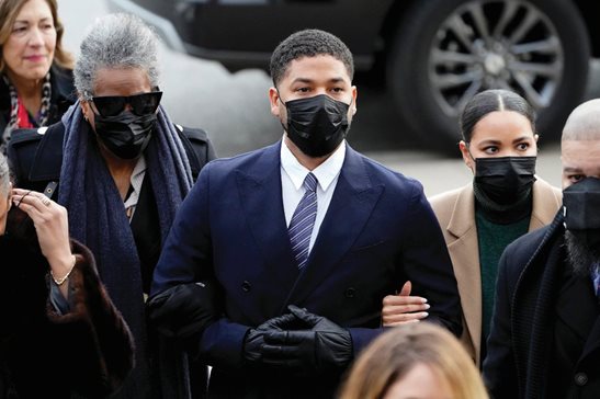 Actor Jussie Smollett walks with family members into the Leighton Criminal Courthouse in November 2021 for jury selection at his trial in Chicago.