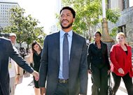 NBA star Derrick Rose leaves federal court in Los Angeles Wednesday. Jurors cleared Rose and two friends in a lawsuit that accused them of gang raping his ex-girlfriend when she was incapacitated from drugs or alcohol. 