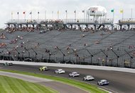 The field for the NASCAR Brickyard 400 auto race makes its way past fans in the stands in the first turn at Indianapolis Motor Speedway on April 23. From tens of thousands of empty seats at the tracks to dwindling ratings for those watching at home, NASCAR has a popularity problem. 