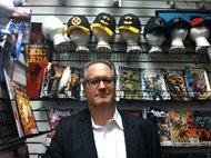Lawrence M. Friedman, posing at Graham Crackers Comics downtown, combined his love of law and comic books in a test he administered this year in the international trade law class he teaches at The John Marshall Law School. 