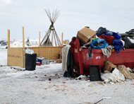 Trash is seen piled at an encampment of a group of opponents to the Dakota Access pipeline in Cannon Ball, N.D., today. Opponents have called for protests around the world as the Army Corps of Engineers approved the final stage of the $3.8 billion project's construction. 