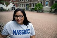Danielle Ramos, 30, poses at MassBay Community College in Wellesley, Mass., where she pursued her education after being defrauded by a for-profit college. Thousands of students who were defrauded by for-profit colleges were told by the Obama administration that their student loans would be forgiven, but the Trump administration has yet to keep that promise. A six-month delay in developing the new rules were announced late last month. 