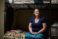 Susan Contreras sits on her bed in a Phoenix-area shelter for victims of domestic violence earlier this month. Contreras is part of a special program at the Barrow Neurological Institute in Phoenix that aims to assist abuse survivors who have suffered head trauma. 
