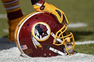 A Washington Redskins helmet is seen on the sidelines of an NFL game in September. The Supreme Court on Monday struck down part of a law that bans offensive trademarks in a ruling that is expected to help the team in their legal fight over the longtime name. 