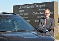 Former LaSalle County state’s attorney Brian J. Towne stands in front of his offices in Ottawa last year. He was indicted Thursday for alleged official misconduct. He is accused of having staff conduct political activity during office hours and of using money generated through his SAFE Unit, a since-disbanded asset forfeiture program, to pay for personal expenses. 