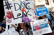 Demonstrators make their way around downtown Philadelphia during the first day of the Democratic National Convention. Florida Rep. Debbie Wasserman Schultz announced she would step down as DNC chairwoman at the end of the party’s convention after some of the 19,000 e-mails, presumably stolen from the DNC by hackers, were posted to the website Wikileaks. The FBI is now investigating the source of the hacks. 