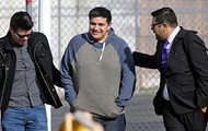 Daniel Ramirez Medina, center, walks out of the Northwest Detention Center in Tacoma, Wash., with his attorney, Luis Cortes, right, and his brother, left, who has not been identified by name, after Ramirez was released from federal custody on Wednesday. Ramirez had spent more than six weeks in immigration detention despite his participation in a program designed to prevent the deportation of those brought to the U.S. illegally as children. 