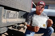 Rancher David Stambaugh holds his cattle brand certificate Thursday in Eloy, Ariz., as he awaited an Arizona Supreme Court decision on whether the state would allow an identical cattle brand to be used by two ranchers. The court ruled in Stambaugh’s favor. Stambaugh has owned the Bar 7 brand since he was 10 years old, but the state Agriculture Department had allowed a California cattle company to use the same brand. 