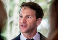 In this Nov. 10, 2016, file photo, former U.S. Rep. Aaron Schock, R-Peoria, talks to reporters in Peoria Heights. Schock, who resigned in 2015, has asked a judge to toss the corruption case against him, arguing that authorities misinterpreted the law and overreached. Lawyers for the Illinois Republican filed the motion to dismiss the case today in Springfield federal court. Schock has pleaded not guilty to mail fraud, theft of government funds and other crimes. 